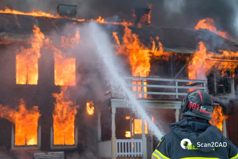 Fire fighters stopping a house fire