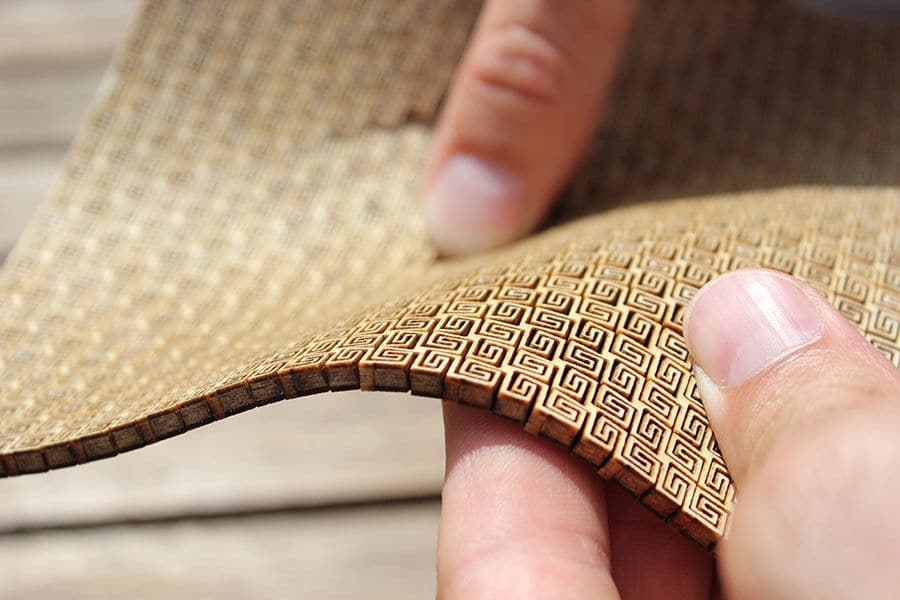Ultra-flexible, CNC laser cut plywood being bent