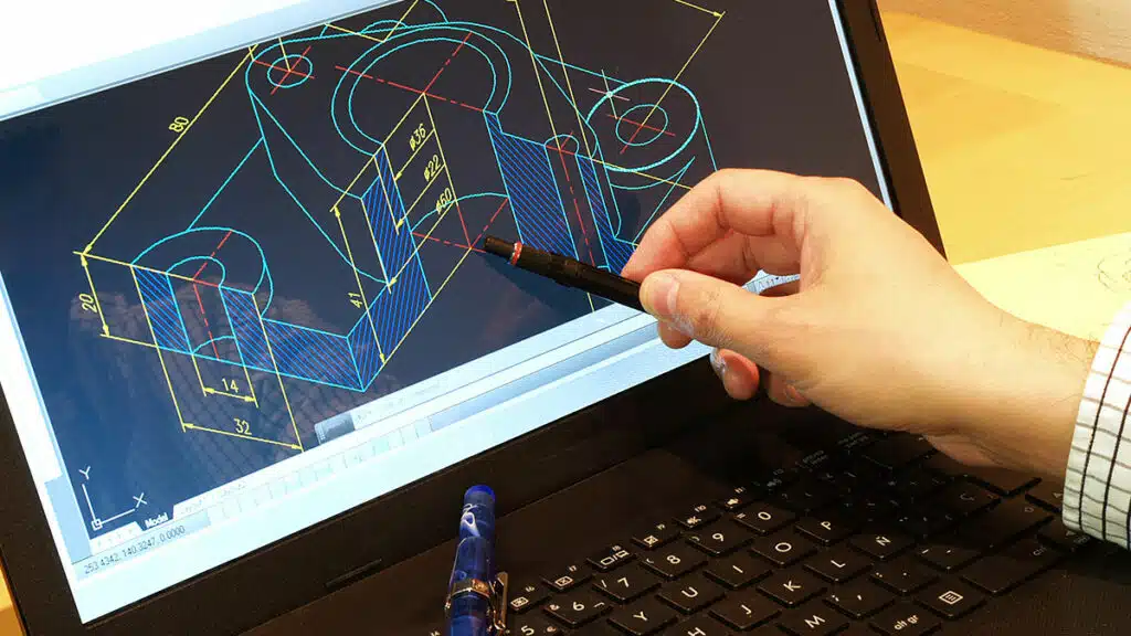 Architectural CAD drafter working on laptop