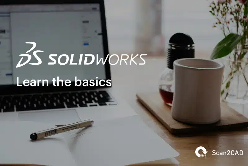 Solidworks Learn The Basics - Laptop and Notepad on Desk